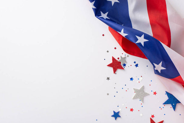 Labor Day in USA concept. Above view photo of empty space with white, blue and red star-shaped sparkles and american flag on the right on white isolated background with copy-space - Φωτογραφία, εικόνα
