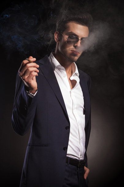 elegant business man holding one hand in his pocket - Фото, зображення