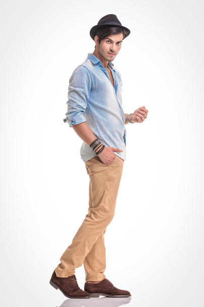 casual man walking on studio background - Zdjęcie, obraz