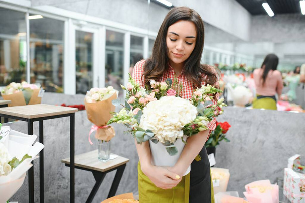 Startup successful sme small business entrepreneur owner woman standing with flowers at florist shop service job. Portrait of caucasian girl successful owner environment friendly concept banner. - Foto, immagini