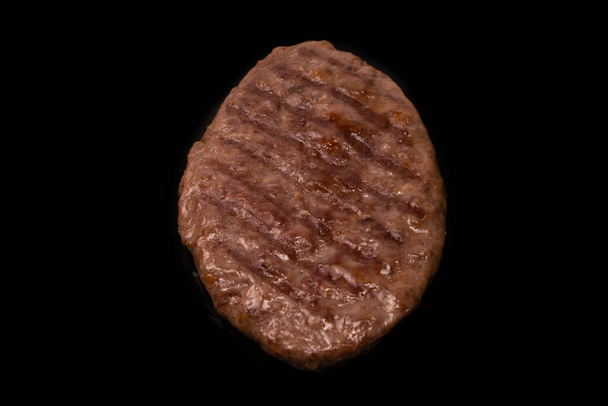 Cutlet with minced beef isolated on a black background. - Foto, Bild