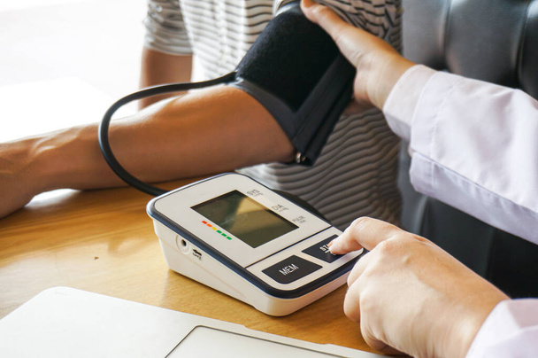 Doctor checking  patient arterial blood pressure. Health care. - Photo, Image