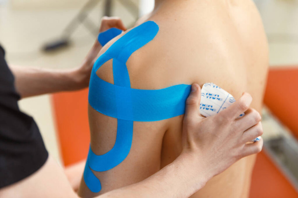 Athletic taping, Sports taping, Rehabilitative care, Rehabilitation approach for individuals with injuries. Restorative care for people with injuries - Foto, Imagem