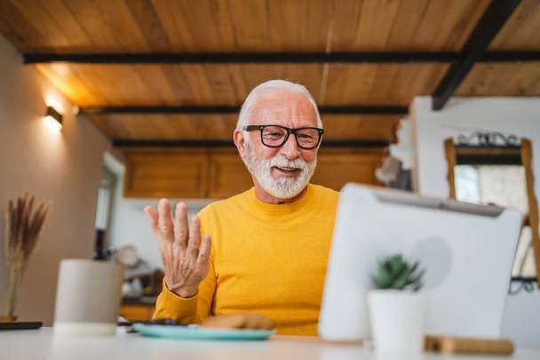 Senior caucasian man use digital tablet to make a video call at home - Photo, image