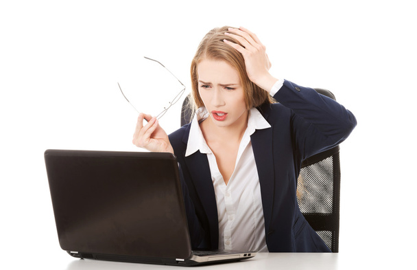 Surprised businesswoman with laptop - Фото, изображение