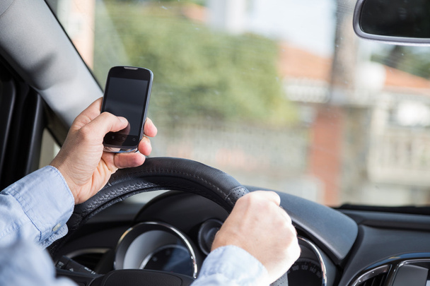 Man with mobile and driving - Foto, imagen