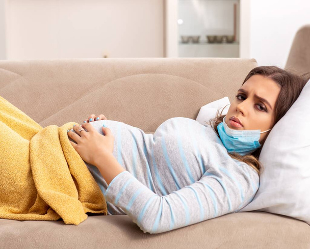 The sick pregnant woman suffering at home - Foto, imagen