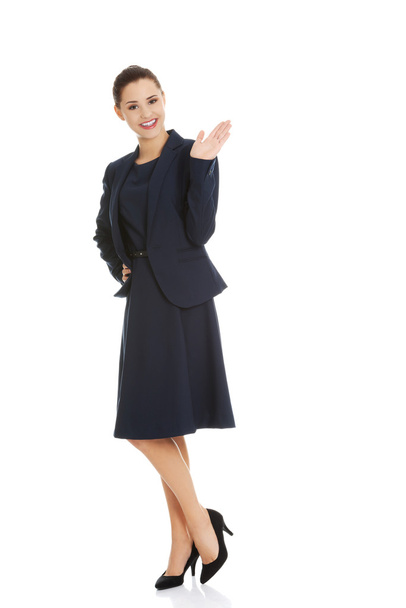 Business woman waving her hand - Foto, afbeelding