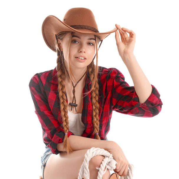 Giovane cowgirl con lazo su sfondo bianco - Foto, immagini