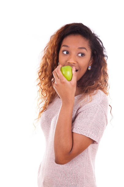 African Americanyoung woman eating one green apple - Black peopl - Foto, Imagen