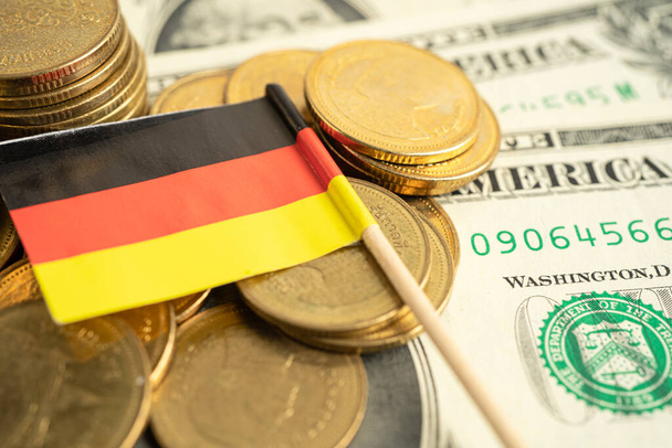 Stack of coins with USA Germany flag on white background. - Fotó, kép