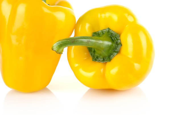 Cropped shot of two yellow bell peppers isolated on white - Foto, Imagem