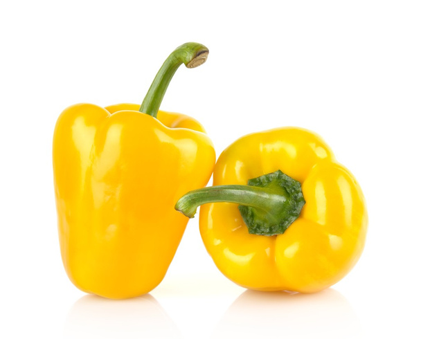 Studio shot of two yellow bell peppers isolated on white - Foto, Imagem