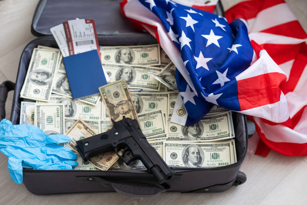 Suitcase with pile of dollars. Opened silver case with money. Better to have bank account. Part of city budget. High quality photo - Foto, Imagen