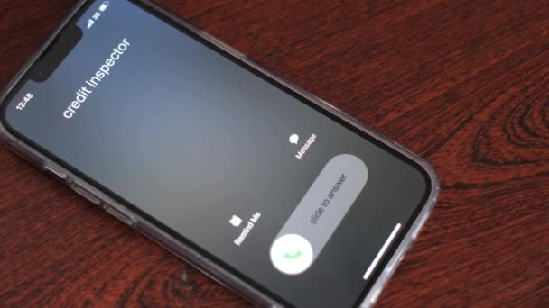 The mobile phone on the table is ringing and an unknown number is calling. The call of Internet fraudsters. High quality 4k video - Footage, Video
