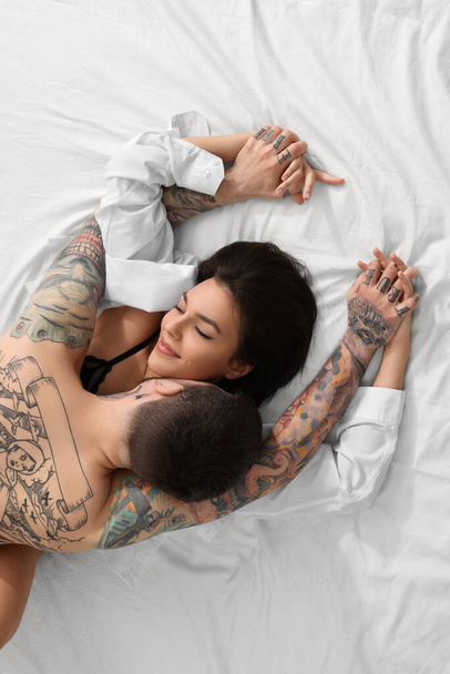 Passionate couple having sex on bed, top view - Fotoğraf, Görsel