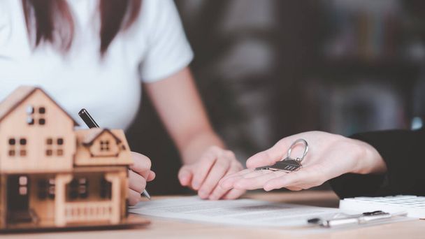 customer checking loan agreement with real estate agent ,Investment loan approval concepts to build residential homes, real estate business ,appraisal of property value ,Signing to approve contract - Photo, Image