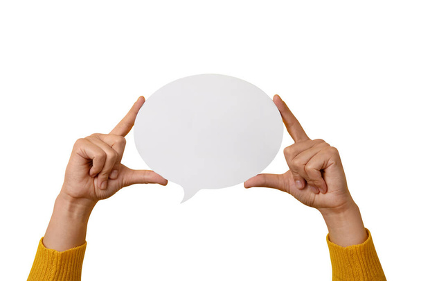Talk bubble speech icon in hands isolated on white background, layout for your text over white round space - Foto, afbeelding