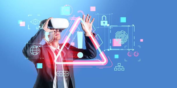 Businessman in vr glasses hand touching virtual screen with red alert sign, diverse security icons, access and authorization. Concept of privacy and confidential information - Photo, image
