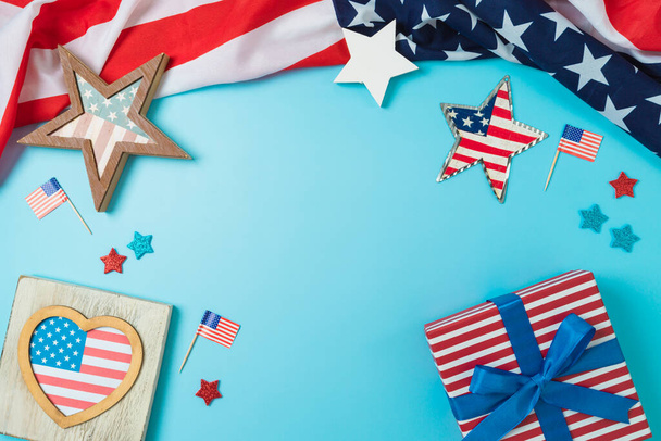 Happy Independence Day, 4th of July patriotic frame border background with gift box, stars and USA flag. Top view, flat lay - 写真・画像