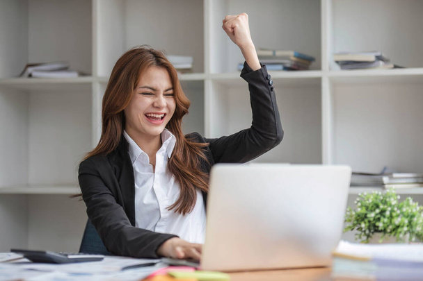Excited female feeling euphoric celebrating online win success achievement result, young woman happy about good email news, motivated by great offer or new opportunity, passed exam, got a job.. - Photo, Image