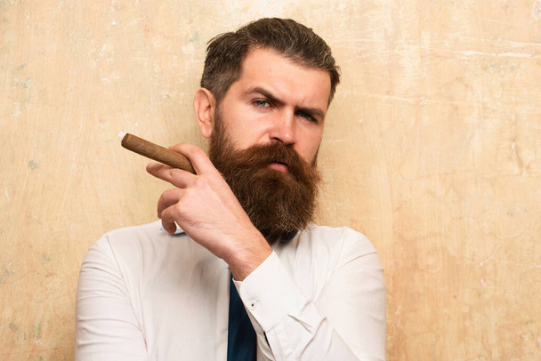 Brutal man smoking cigar, handsome serious male model - Φωτογραφία, εικόνα