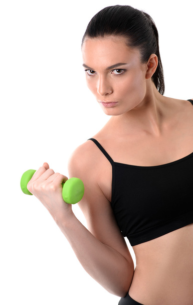 Portrait of fitness woman working out with dumbbell - Фото, зображення
