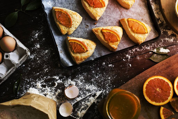 Homemade scones with orange jam food photography recipe idea - Photo, Image