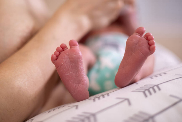 Infant Small Feet Close Up. Baby on mother lap - Foto, Imagem