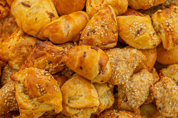 Cheese buns with spices, salty snacks. Bread with cheese filling - Photo, Image