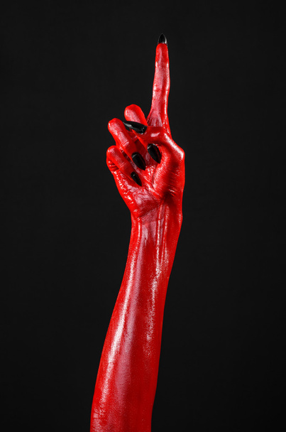 Red Devil's hands, red hands of Satan, Halloween theme, black background, isolated - Fotoğraf, Görsel