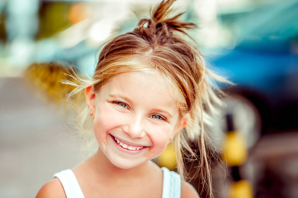 Portrait of a happy cute liitle girl close-up - Фото, зображення