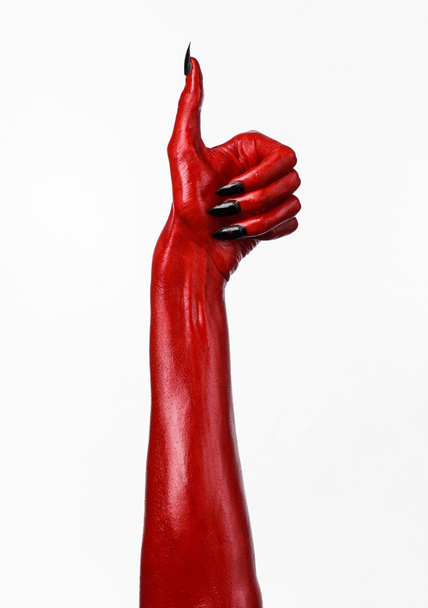 Red Devil's hands, red hands of Satan, Halloween theme, white background, isolated - Foto, Imagen