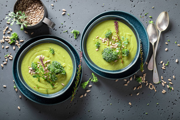 Green broccoli soup as fresh and healthy starter. Vegan soup made of vegetables. - Zdjęcie, obraz