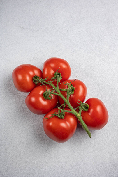Red tomatoes in the background. Close up - Valokuva, kuva
