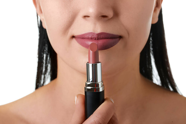 Woman with lipstick on white background, closeup - Photo, Image