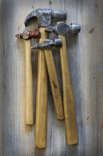 four different hammer on a wooden - Foto, Imagen