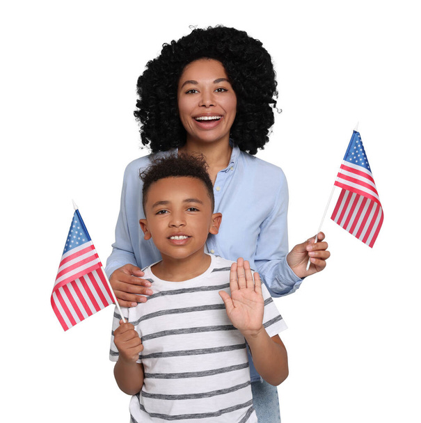 4th of July - Independence day of America. Happy woman and her son with national flags of United States on white background - Foto, immagini