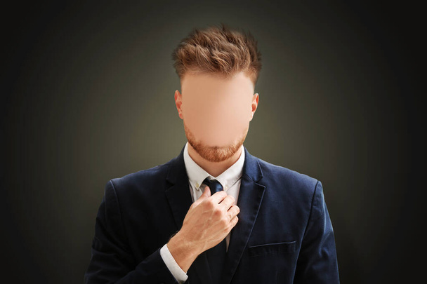Anonymous. Faceless man in suit on dark background - Φωτογραφία, εικόνα