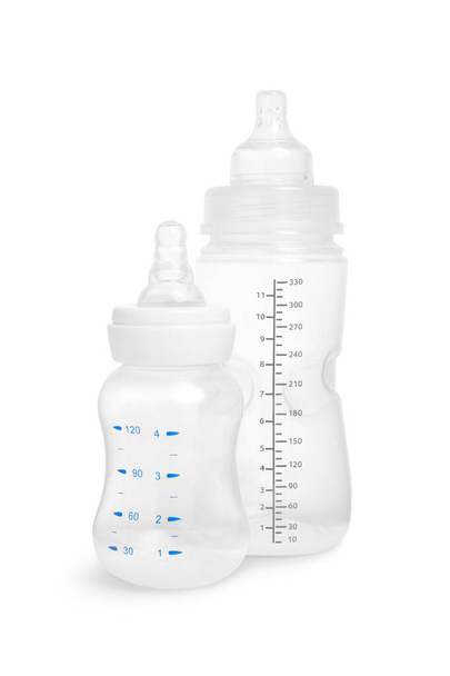 Two empty feeding bottles for baby milk on white background - Foto, imagen