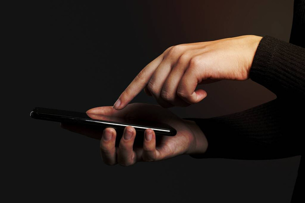 Finger pressing on a smartphone screen - Fotó, kép