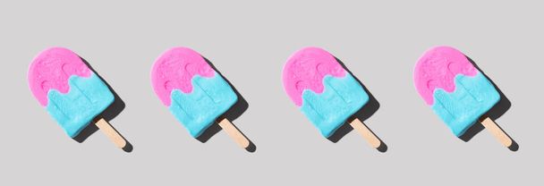 Pink and blue popsicles with shadow - flat lay - Zdjęcie, obraz