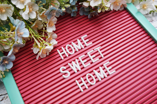 Home Sweet Home text on Letter Board with flower decoration - 写真・画像