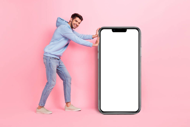 Full body length photo of young positive user smartphone promoter pushing empty space display app for dating isolated on pink color background. - Φωτογραφία, εικόνα
