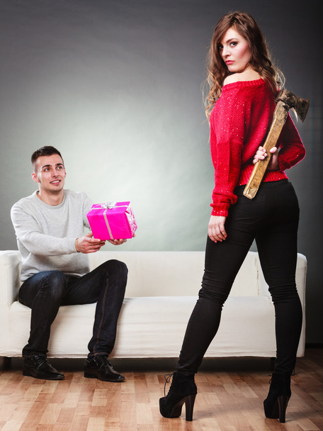 Trusting guy giving present to misleading girl - Foto, Imagen