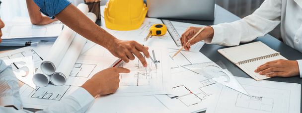 Architect or engineer working on building blueprint, contractor designing and drawing blueprint layout with tool for construction project. Civil engineer and architecture design concept. Insight - Fotoğraf, Görsel