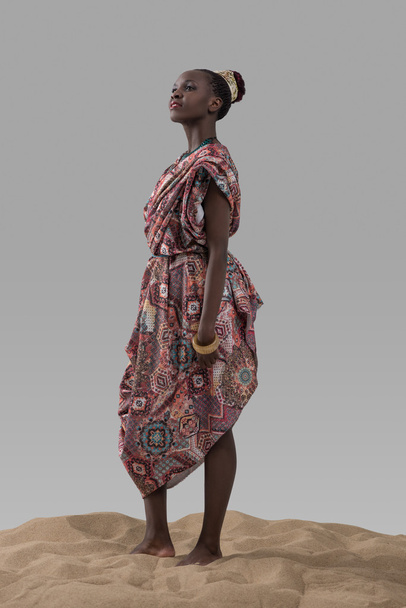 African woman standing on sand - Fotó, kép