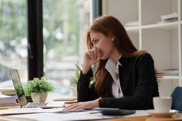 Deadline with young business woman feeling stressed concept. Business woman working at office, business finance concept. - Photo, Image