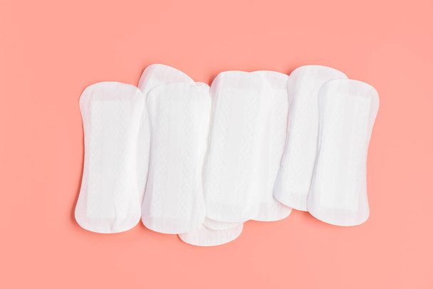 Menstrual pads on coral background - Φωτογραφία, εικόνα