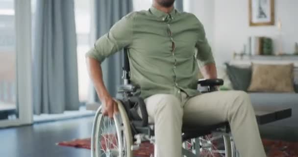 Happy man, wheelchair and smile in confidence for life insurance, support or healthcare at home. Portrait of confident African male person with a disability smiling on wheel chair in living room. - Filmagem, Vídeo